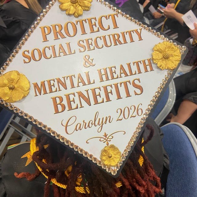 Graduate wearing a 'Protect Social Security and Mental Health Benefits Carolyn 2026' grad cap topper