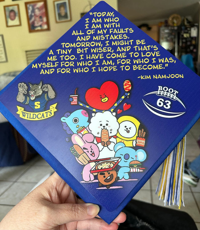 Hand holding BT21 cartoon characters topper