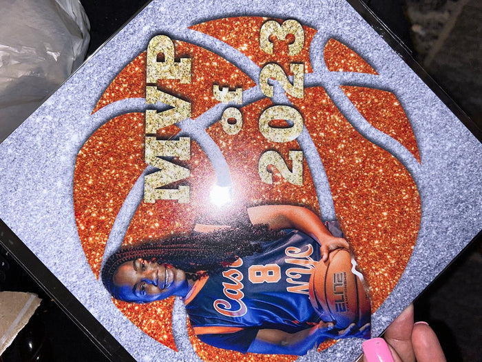 Hand holding MVP 2023 basketball photo topper