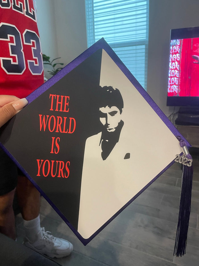 Person holding Scarface The World Is Yours topper