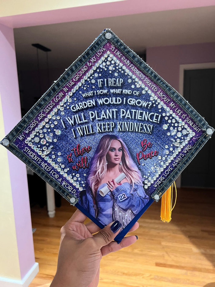 Hand holding Carrie Underwood Plant Patience topper