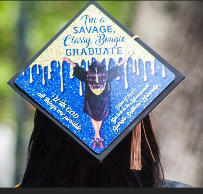 Graduate wearing Savage Classy Bougie Graduate blue drip cap