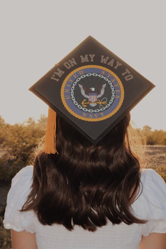 Woman wearing Navy seal On My Way cap, back view