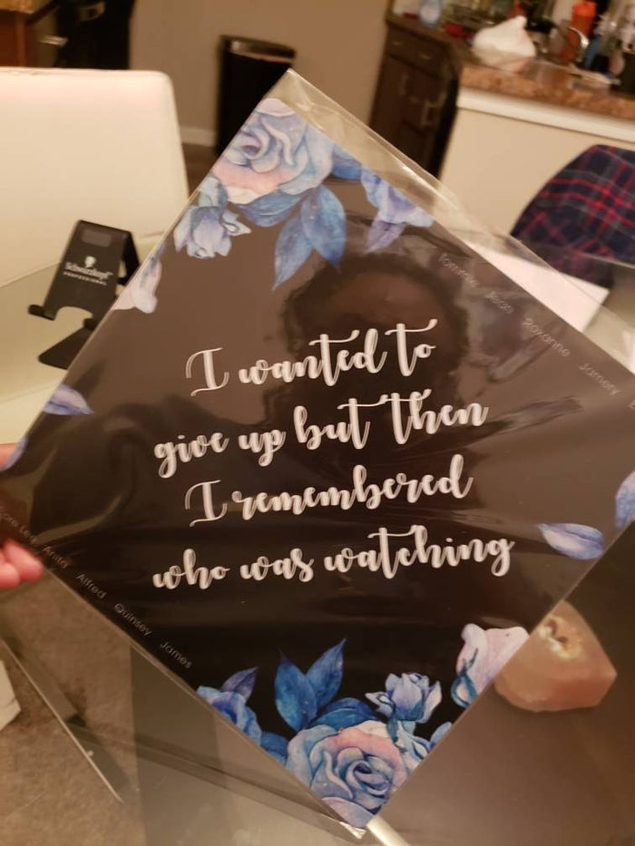 Hand holding I Wanted To Give Up floral topper in sleeve