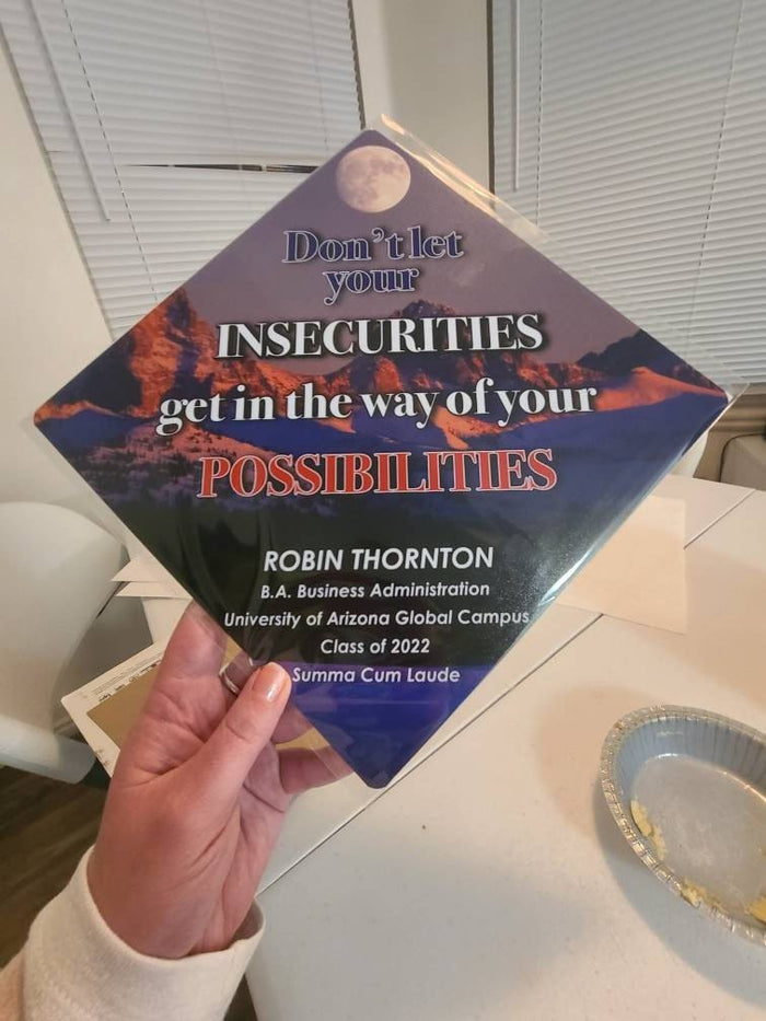 Hand holding Dont Let Your Insecurities topper