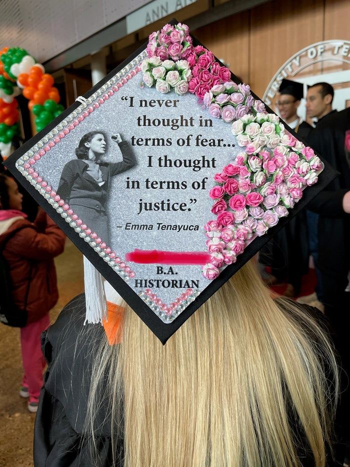 Graduate wearing Emma Tenayuca quote cap with pink roses