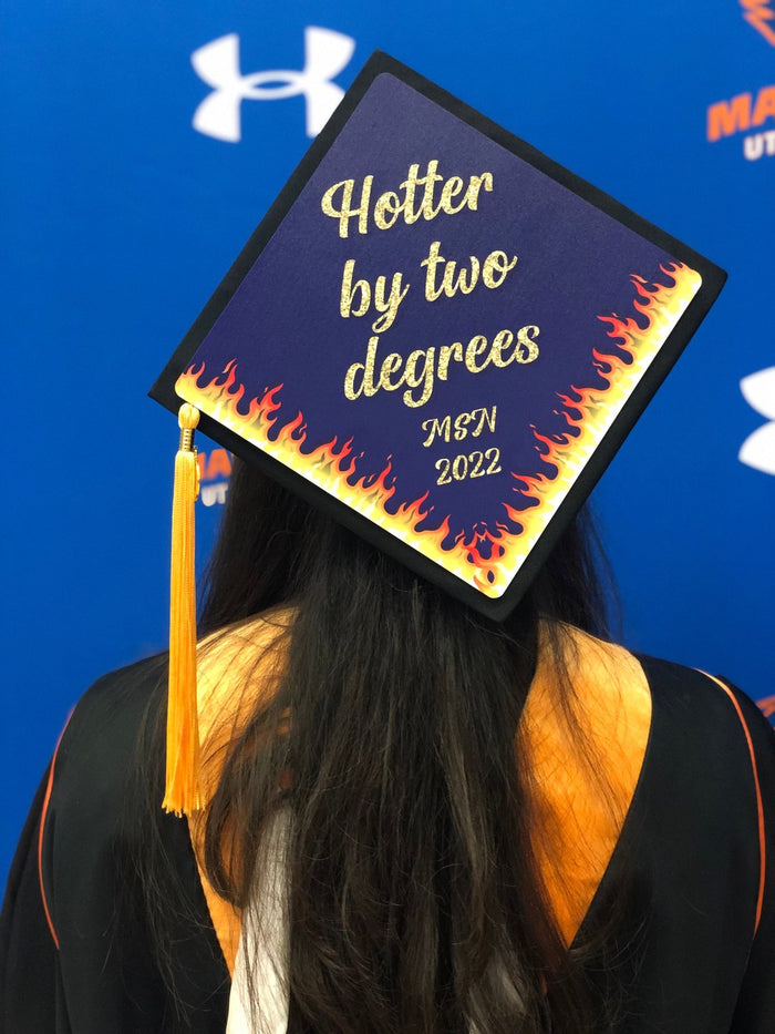 Graduate wearing Hotter By Two Degrees MSN flame cap, back view