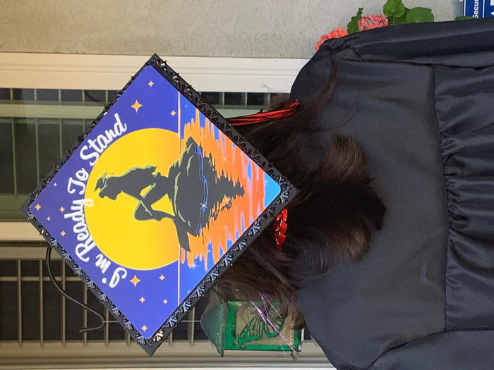 Graduate wearing Cowboy Bebop Ready To Stand cap, back view
