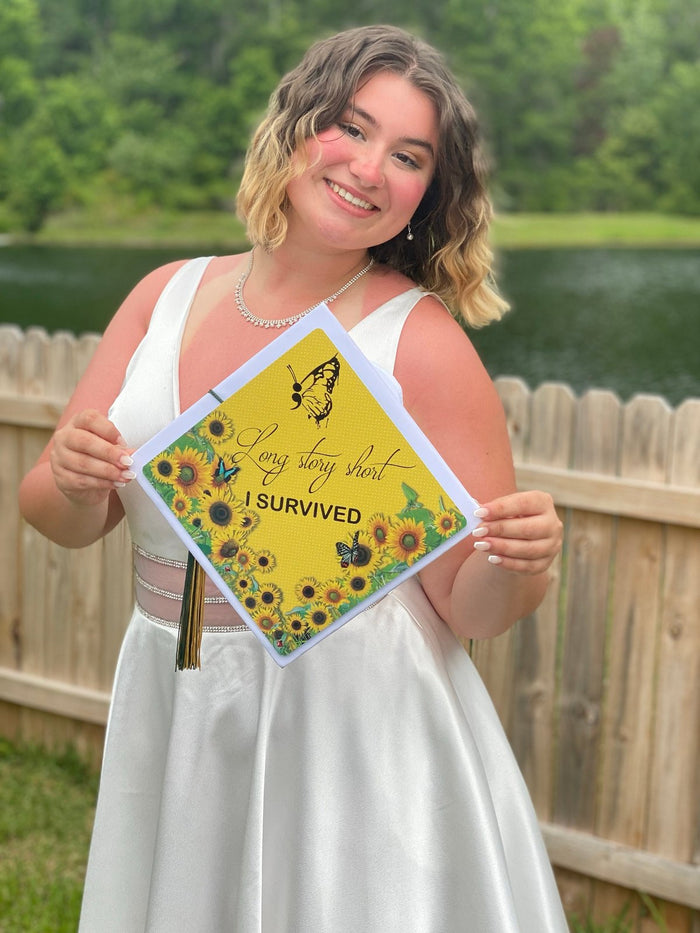 Woman in white dress holding Long Story Short I Survived sunflower cap