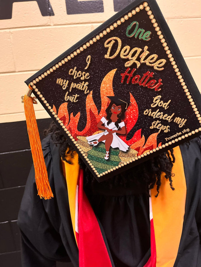 Graduate wearing One Degree Hotter cap, back view