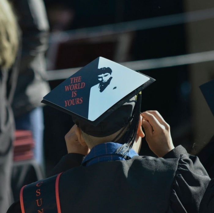 Graduate adjusting Scarface The World Is Yours cap