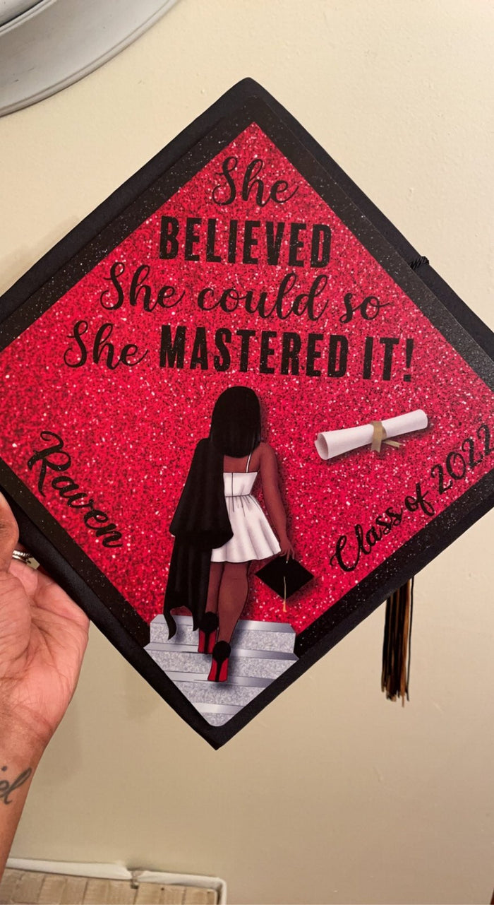 Hand holding She Believed She Mastered It Raven topper