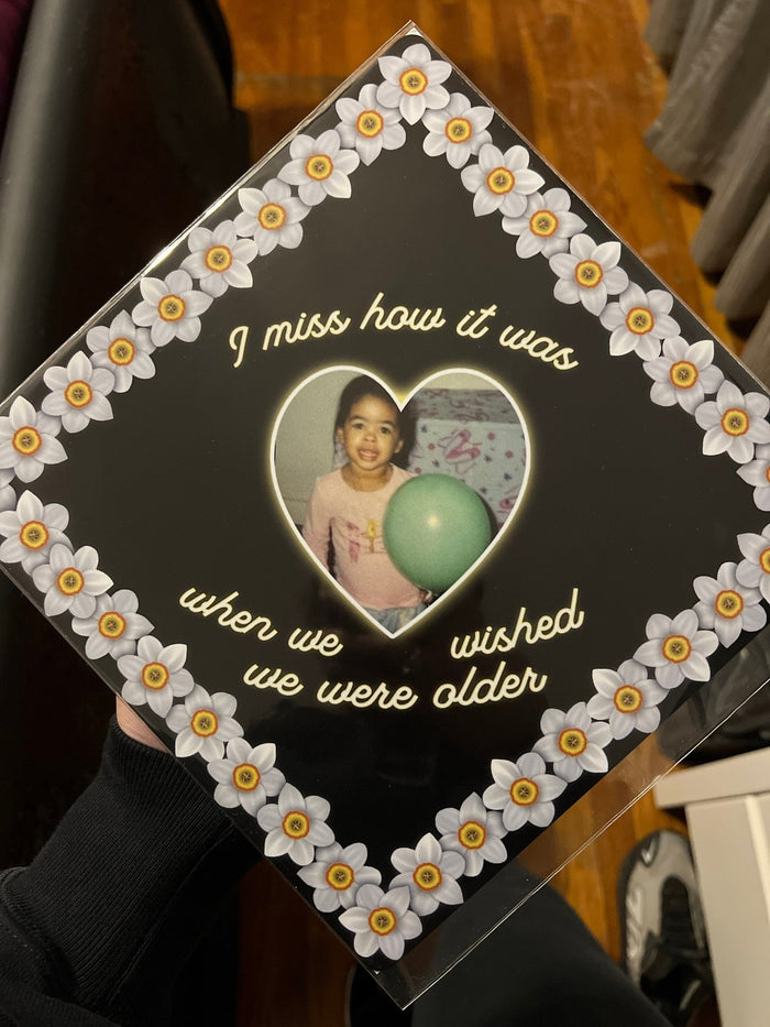 Person holding daisy heart photo topper