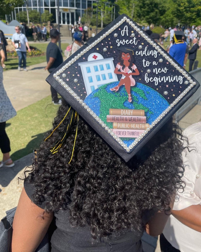 Graduate wearing Sweet Ending nurse cap at ceremony