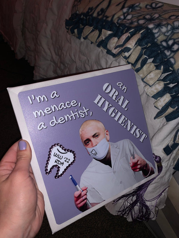 Hand holding Dr Evil Menace Dentist hygienist topper