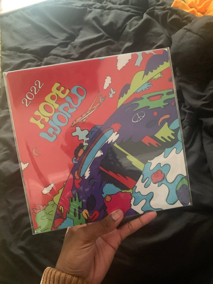 Hand holding Hope World 2022 topper