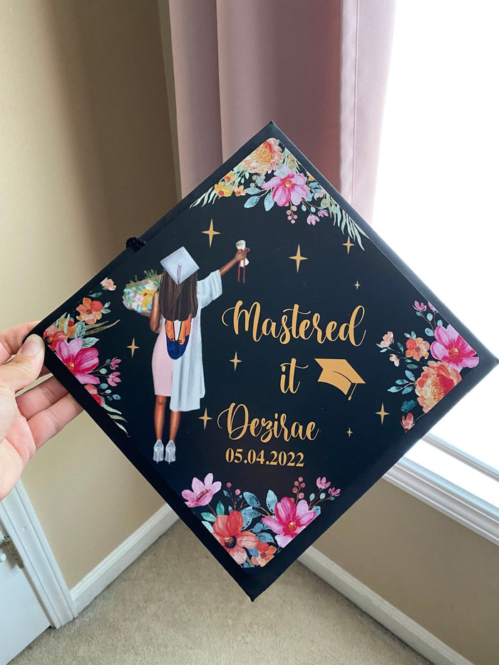 Hand holding Mastered It Desirae floral topper