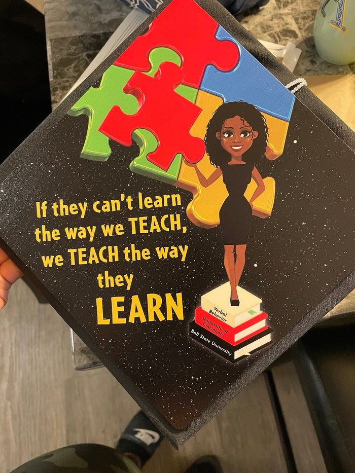 Hand holding autism puzzle Teach The Way They Learn topper