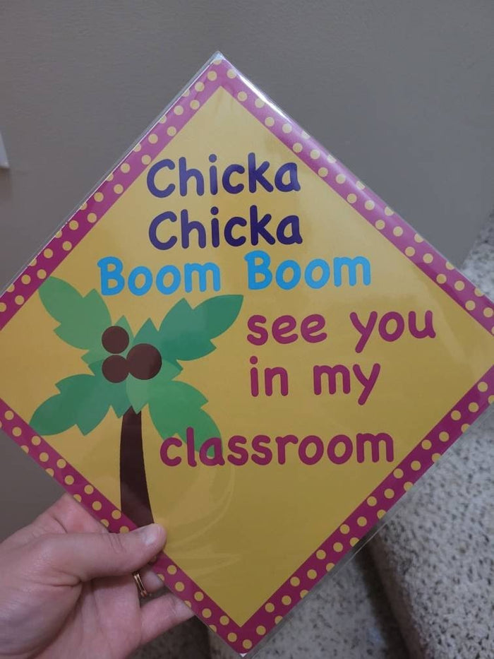 Hand holding Chicka Chicka Boom Boom classroom topper