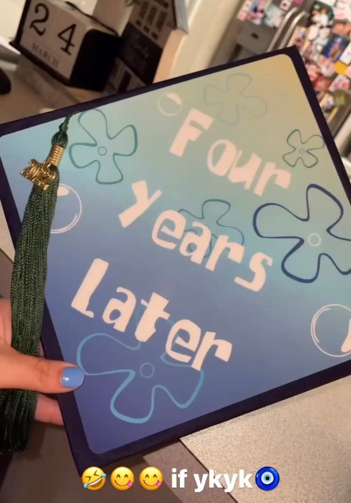 Hand holding SpongeBob Four Years Later topper