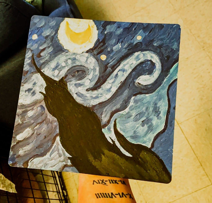 Arm holding hand-painted Starry Night wolf topper