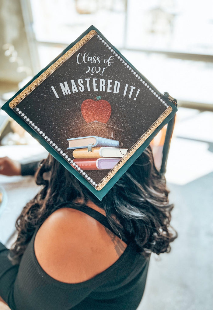 Woman wearing Class of 2021 I Mastered It teacher cap