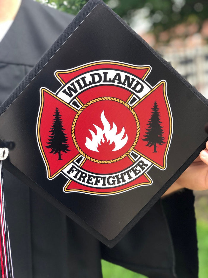 Person holding Wildland Firefighter cap