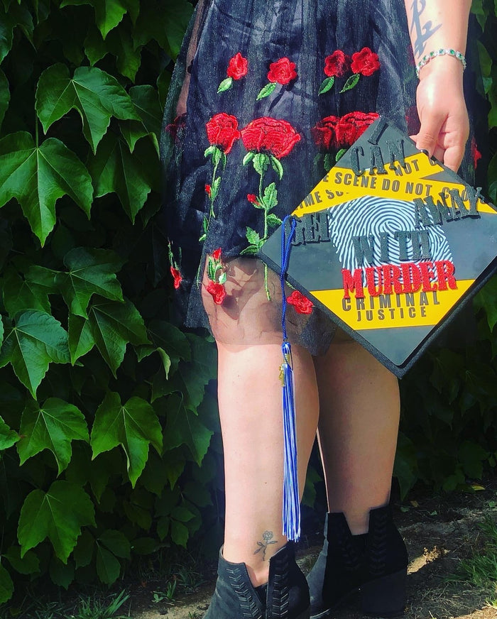 Woman holding crime scene Murder criminal justice cap