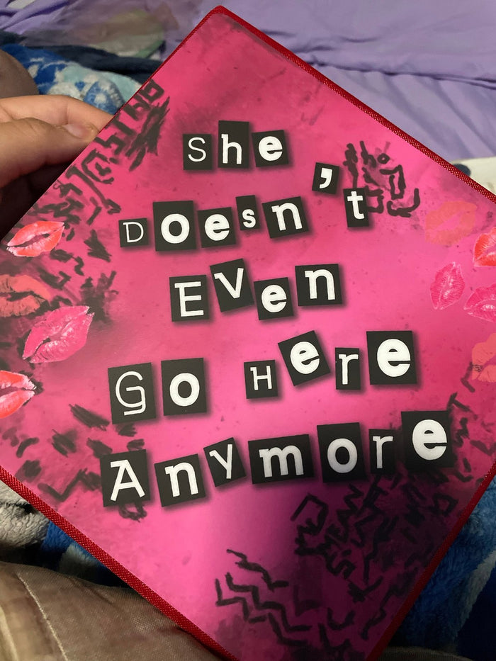 Hand holding Mean Girls pink topper