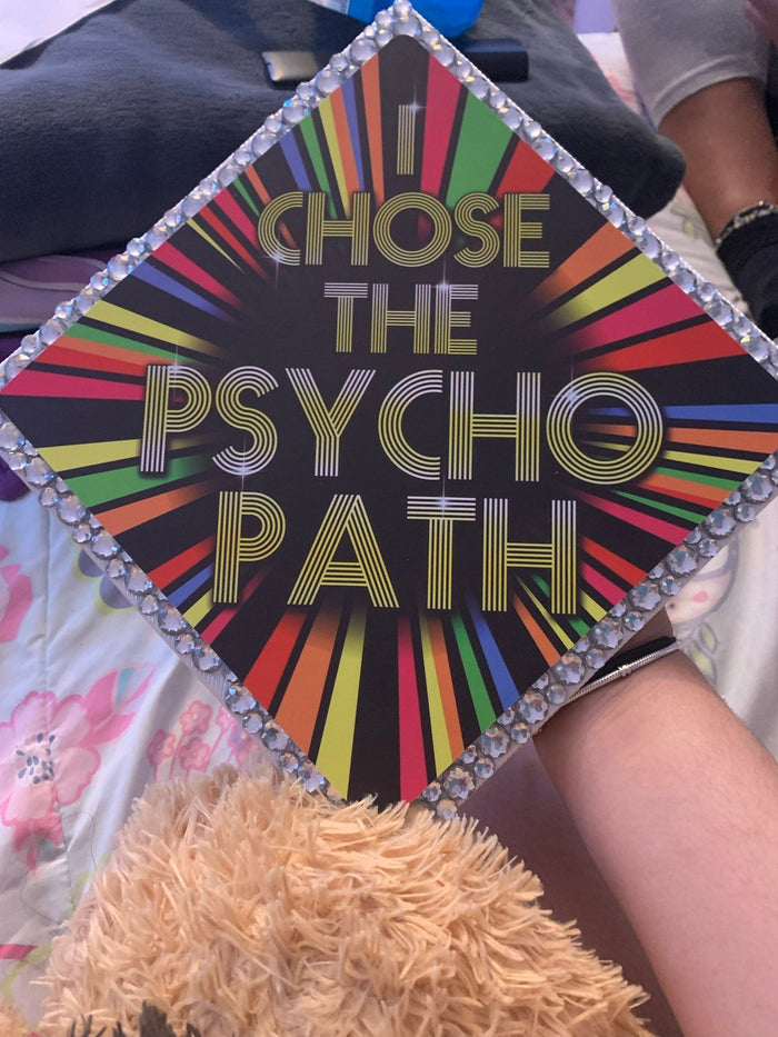 I Chose The Psycho Path topper on graduates lap