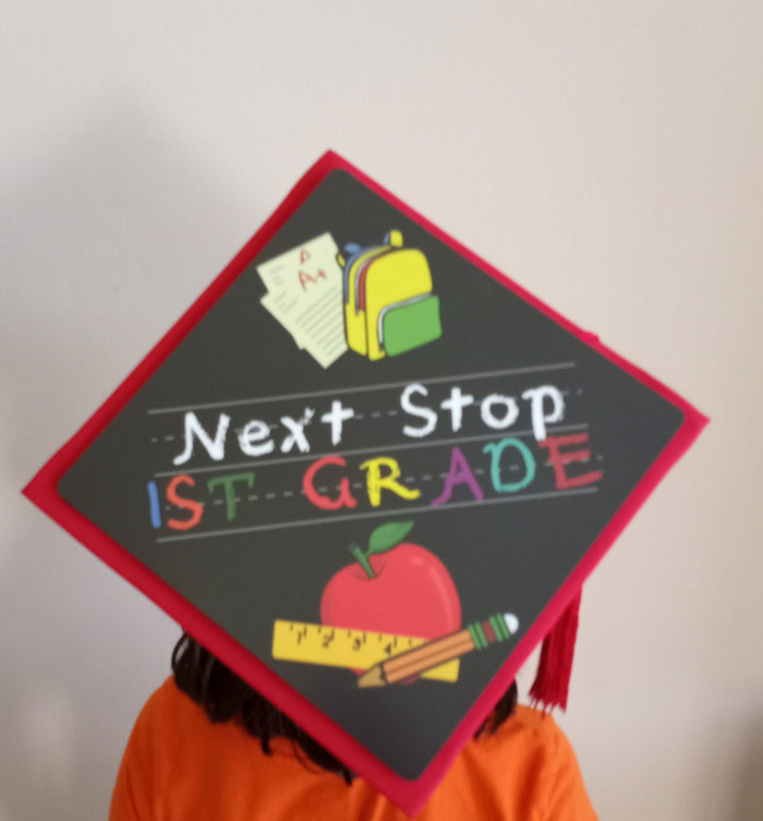 Child wearing Next Stop 1st Grade cap