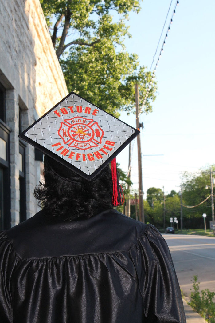 Graduate wearing Future Firefighter cap on street