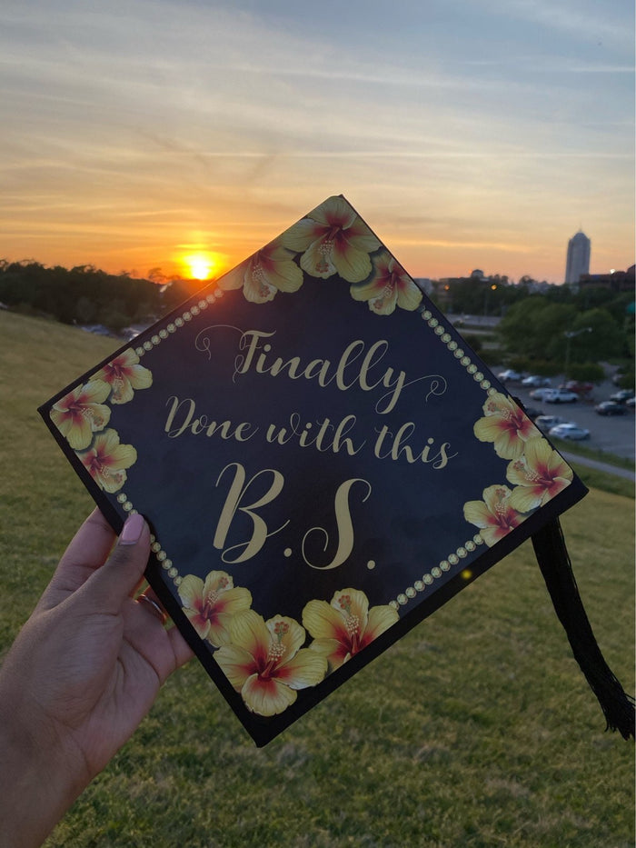 Hand holding Finally Done With This BS floral cap at sunset
