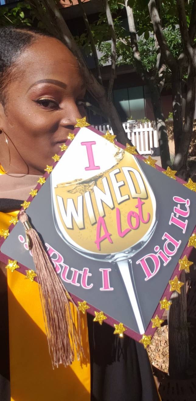 Woman holding I Wined A Lot But I Did It cap