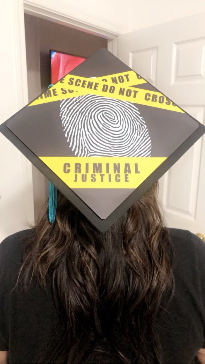 Woman wearing criminal justice fingerprint cap