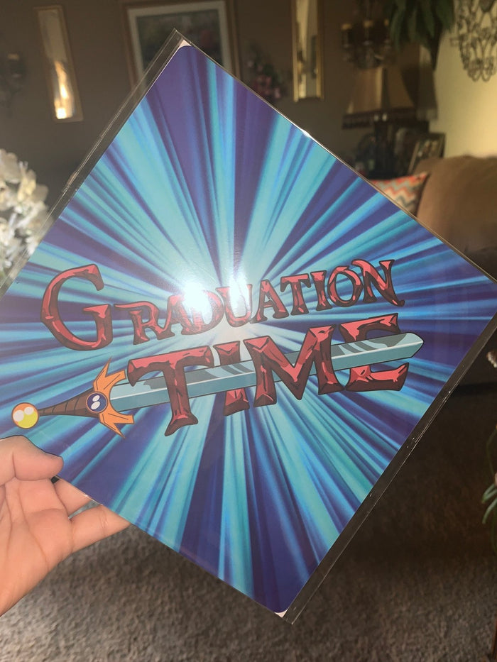 Hand holding Adventure Time Graduation Time topper