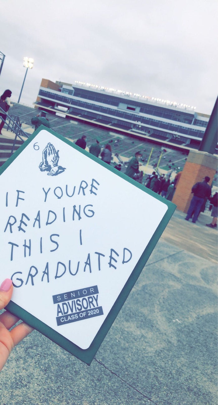 Hand holding If Youre Reading This I Graduated topper at stadium