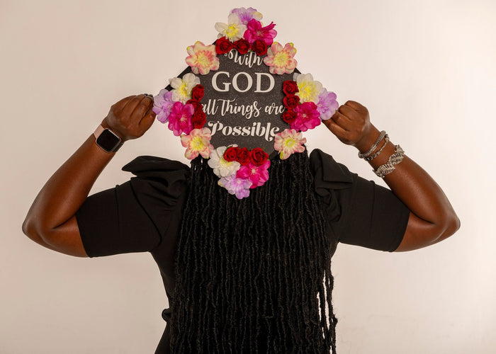 Woman holding flower With God cap over face