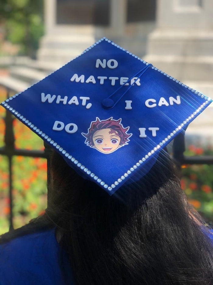 Graduate wearing Demon Slayer No Matter What cap