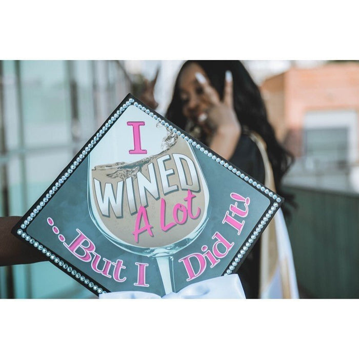Woman holding I Wined A Lot But I Did It cap