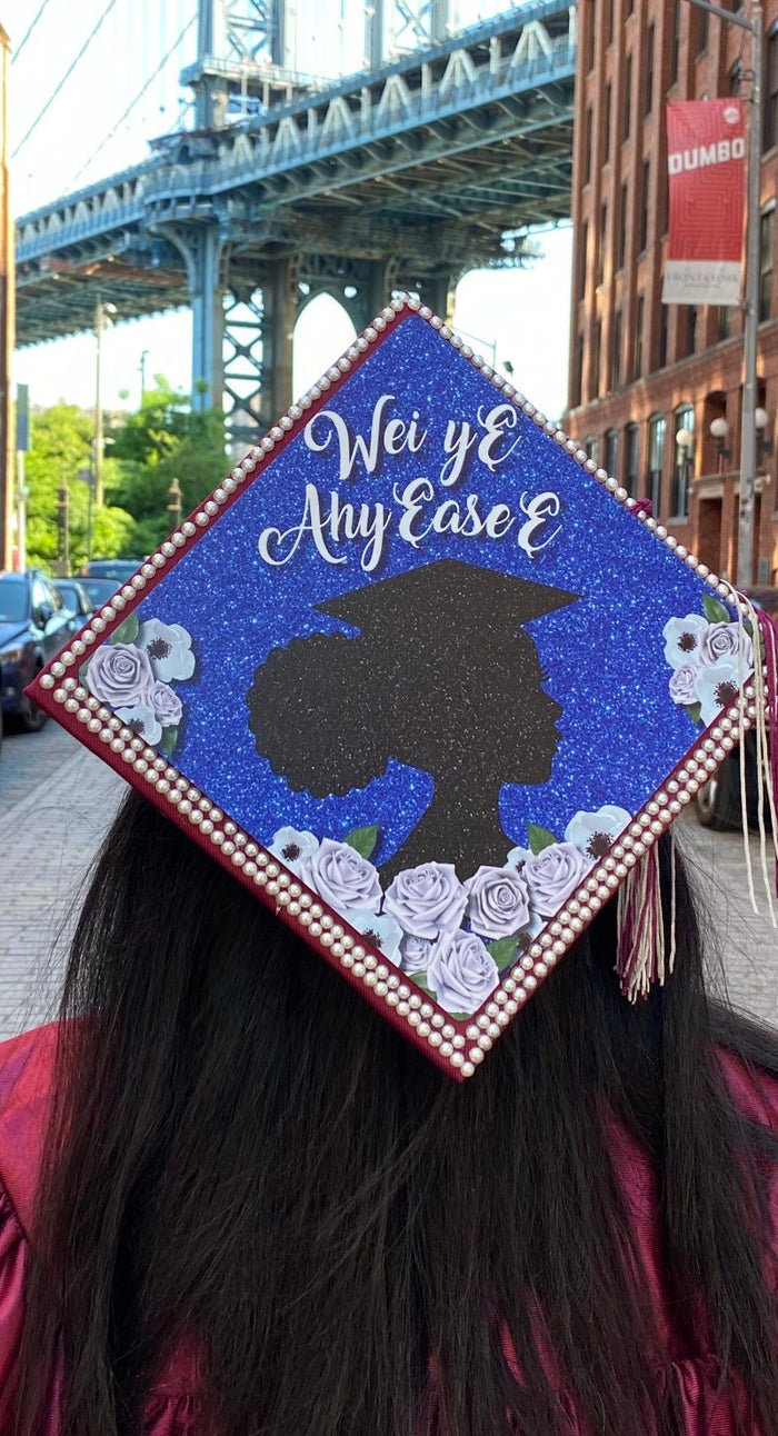 Graduate wearing Wei Ye Ally Case silhouette cap under bridge