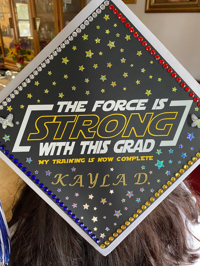 Graduate wearing The Force Is Strong Kayla D cap