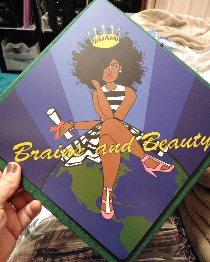 Hand holding Brains And Beauty topper