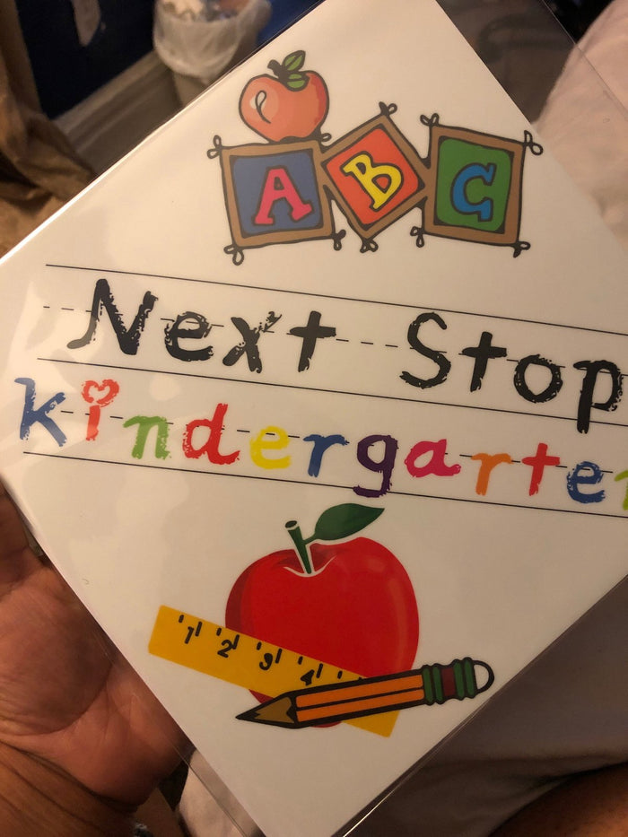 Hand holding Next Stop Kindergarten ABC topper