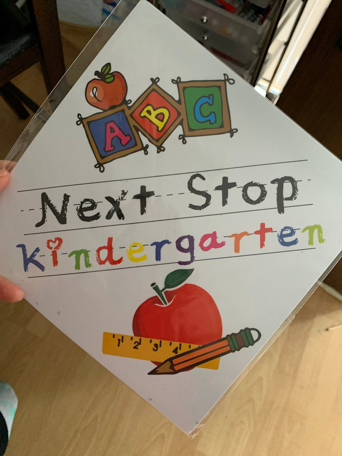 Hand holding Next Stop Kindergarten topper