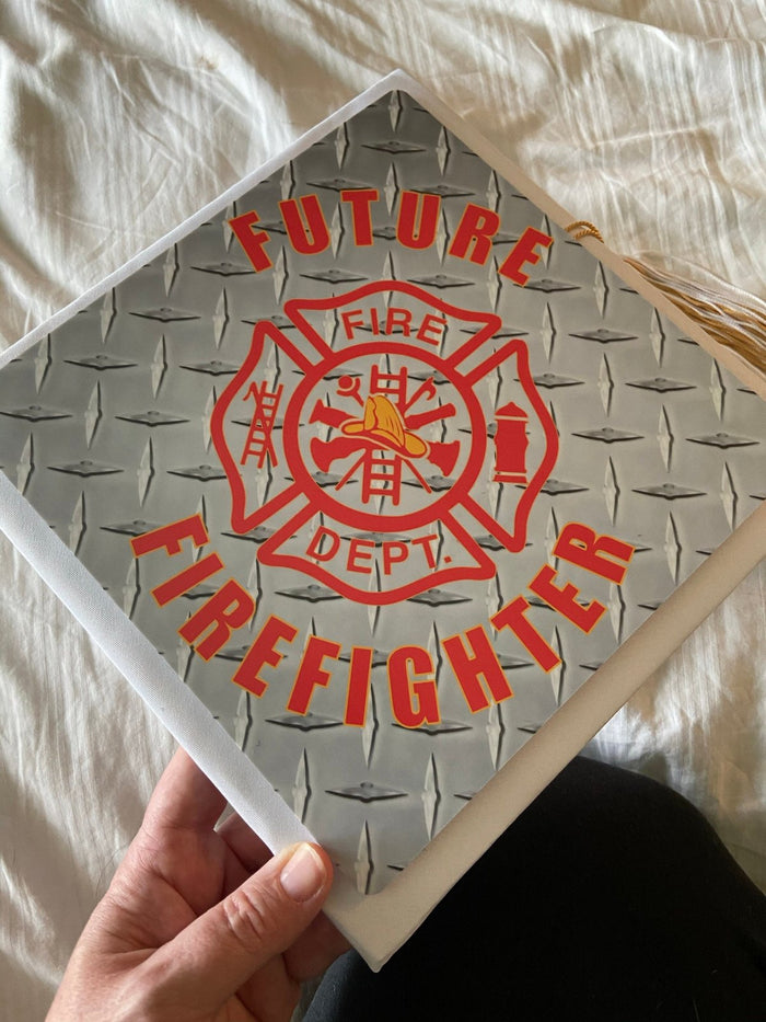 Hand holding Future Firefighter diamond plate topper