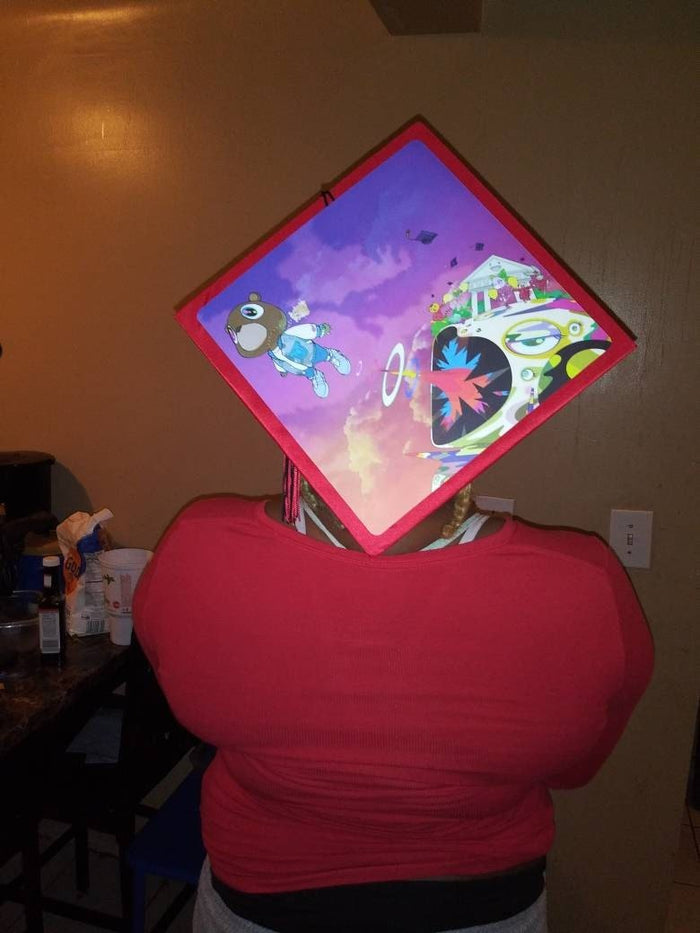 Person wearing Kanye cap indoors