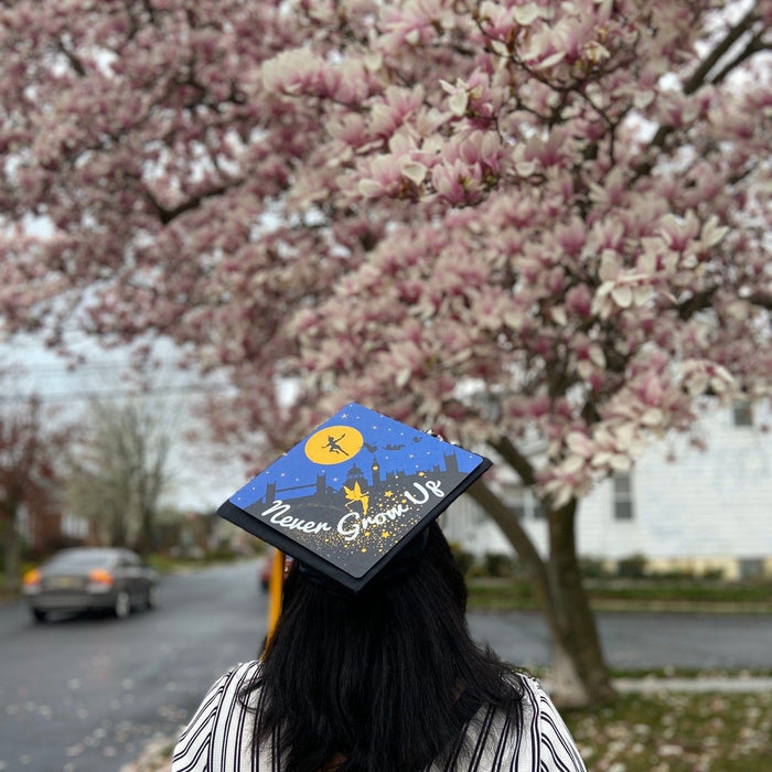 Woman wearing Peter Pan Never Grow Up cap