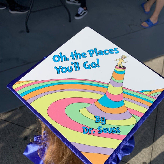 Child wearing Dr Seuss Oh The Places Youll Go cap