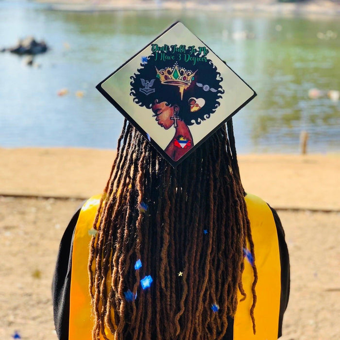 Graduate wearing crown queen cap at beach